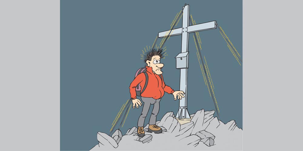 Grafik Mann steht vor einem Gipfelkreuz in den Alpen